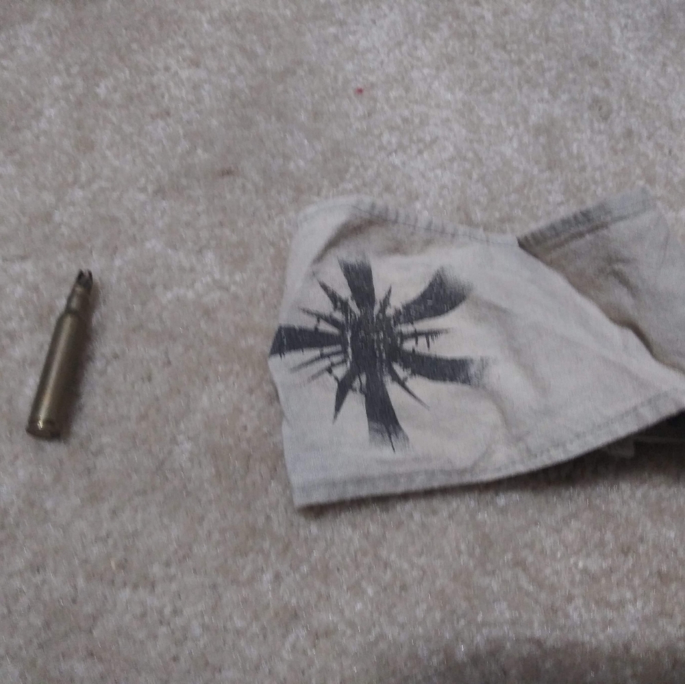 Theo James arm band and bullet from Insurgent